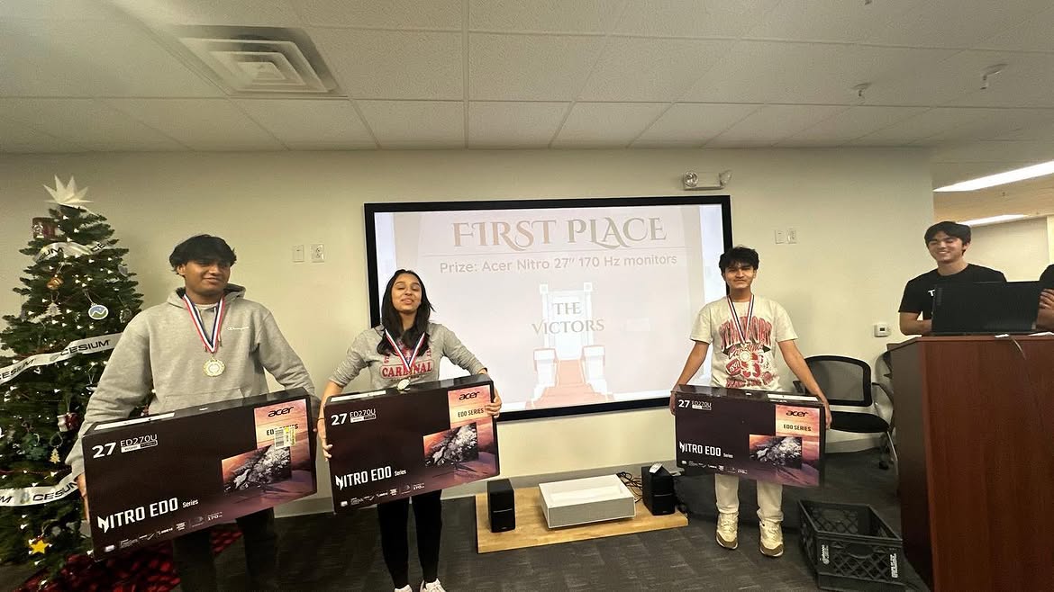 First place winners holding monitors